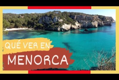 8Bmw3OMmndg vista aérea de cala de Menorca con agua turquesa, arena y acantilados