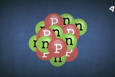 Ilustración esquemática de un núcleo atómico con círculos rojos y verdes que representan protones y neutrones USDLwPKpNxs.