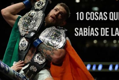 Peleador en el octágono con varios cinturones de campeón y bandera irlandesa mientras descubre todo sobre que significa ufc ultimate fighting championship