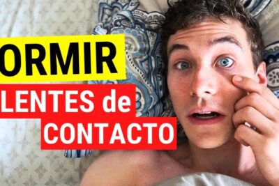 Joven sorprendido en la cama tocándose el ojo relacionado con dormir lentillas 2.