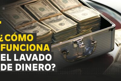 Maletín abierto con fajos de dólares que ilustra el lavado de dinero eIR9sWVlsvQ.