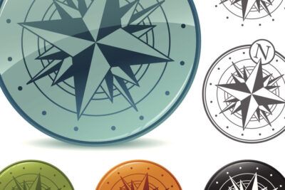 Iconos circulares de rosa de los vientos y compás en varios colores que representan el simbolismo de un tatuaje de brujula y su significado 2.