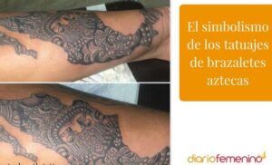 Brazalete tatuado en antebrazo con motivos aztecas y relieves en negro y gris, que representa un tatuaje de arbol descubre su significado