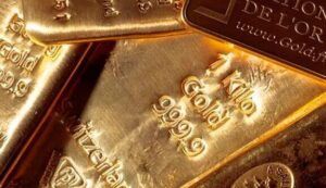 Lingotes de oro brillantes apilados que invitan a reflexionar sobre valor y pérdida, que significa sonar con ser abandonado guia y significado