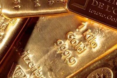 Lingotes de oro brillantes apilados que invitan a reflexionar sobre valor y pérdida, que significa sonar con ser abandonado guia y significado