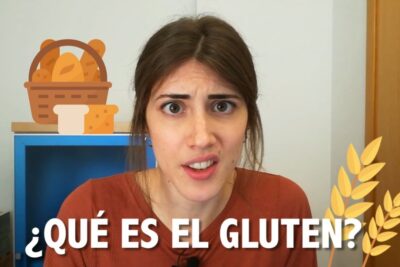 Mujer con expresión interrogante frente a iconos de pan y espigas y texto '¿Qué es el gluten?' sD0dGAH7vPc