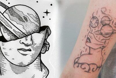 Tatuaje en el hombro y brazo con figura femenina, planetas y estrellas que sugiere significado de un tatuaje de estrella en el hombro que representa conexión cósmica.